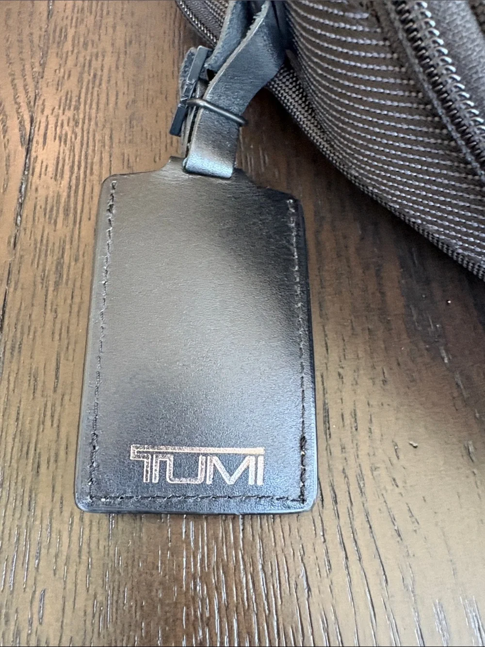 Tumi Black Backpack with Tan Accent